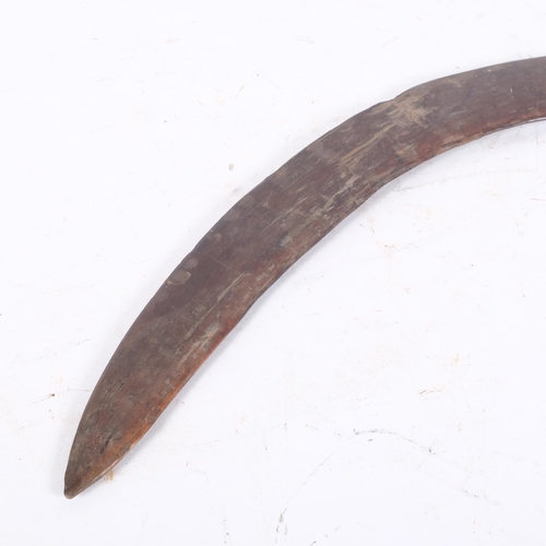 125 - An Australian Aboriginal boomerang, 65cm