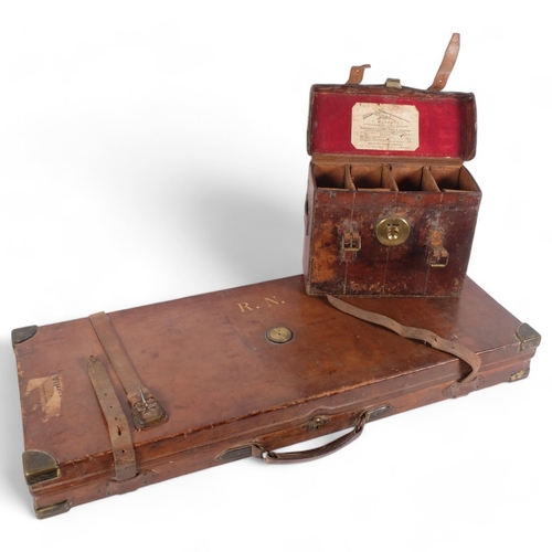 129 - HOLLAND & HOLLAND - an Antique brown leather and brass-mounted rectangular gun box, with a fitted in... 