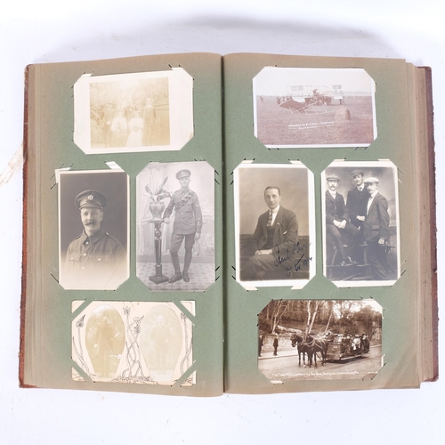 165 - A mixed album of Vintage postcards, including military, family, topographical and greetings cards