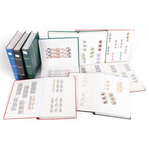 172 - 9 stamp albums containing various Mint First Day stamps and stock books, various reference books, et... 