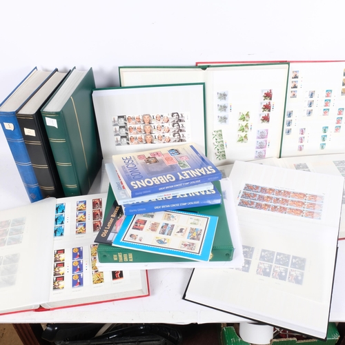 172 - 9 stamp albums containing various Mint First Day stamps and stock books, various reference books, et... 