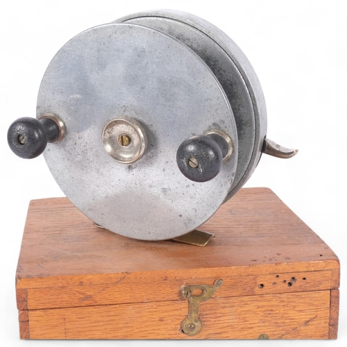 20 - A Vintage brass and metal fishing reel, unmarked, diameter 15cm, in bespoke handmade wooden case