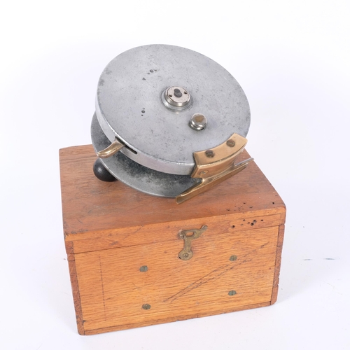 20 - A Vintage brass and metal fishing reel, unmarked, diameter 15cm, in bespoke handmade wooden case