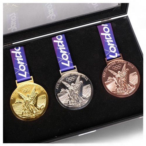 227 - A set of 3 reproduction 2012 Olympic medals, in beautifully crafted handmade case.