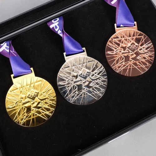 227 - A set of 3 reproduction 2012 Olympic medals, in beautifully crafted handmade case.