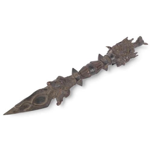 233 - A Tibetan bronze vajra ceremonial dagger, decorated with Buddha heads and stylised animals, L61cm