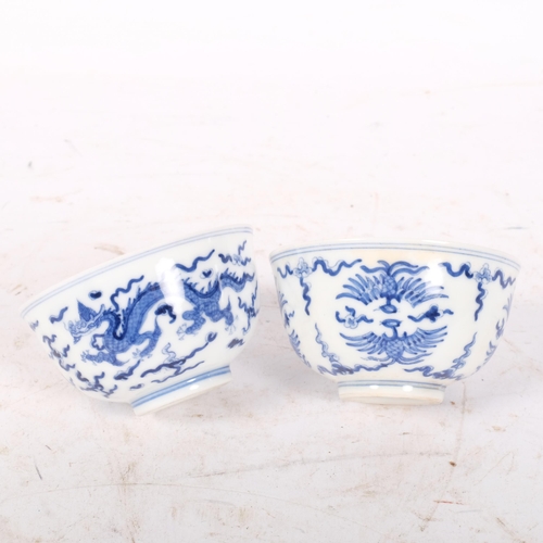 243 - 2 Chinese blue and white tea bowls, both with 6 character marks on bases, diameter 8cm