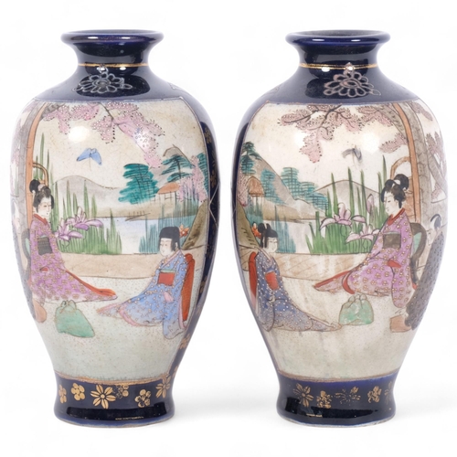 245 - A pair of Japanese blue Satsuma vases, with decorated figural panels, H15cm