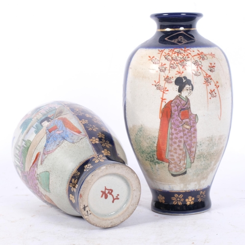 245 - A pair of Japanese blue Satsuma vases, with decorated figural panels, H15cm