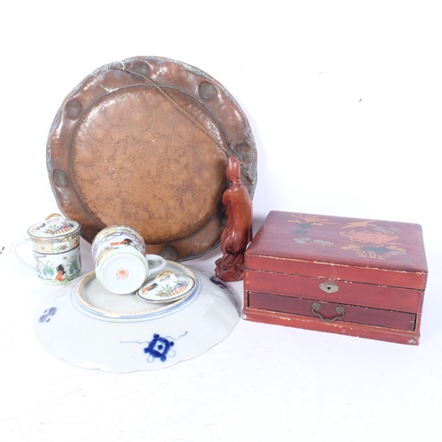 258 - A Chinese red lacquered jewellery box with fitted tray, an Imari charger, a copper charger, a carved... 