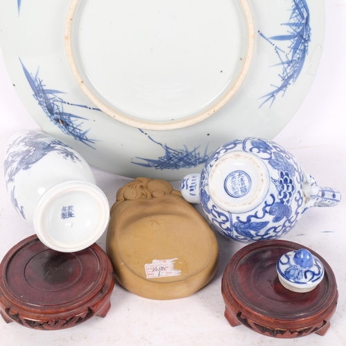 261 - A group of Chinese ceramics, including a blue and white charger with prunus decoration, diameter 29c... 