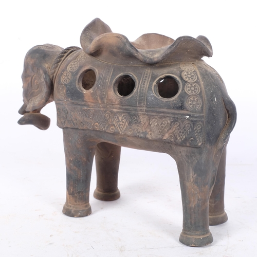 264 - An Indian terracotta ceremonial elephant, incised decoration, H21cm