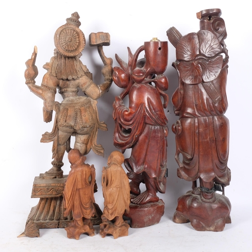 267 - A group of carved Oriental hardwood figures, to include 2 sages, a figure of a Vishnu, etc, tallest ... 