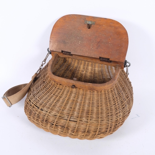 27 - An early 20th century handmade wicker fishing creel, with wooden lid and original strap, 33cm x 19cm... 