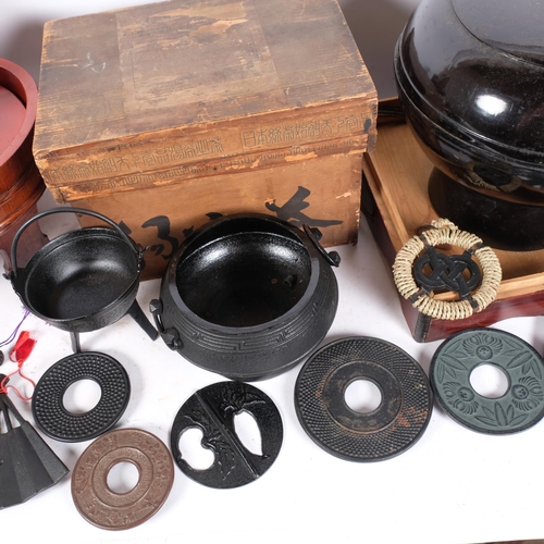 279 - A Japanese black lacquered bowl and cover on stand, with travelling box, cast-iron tea kettle in ori... 