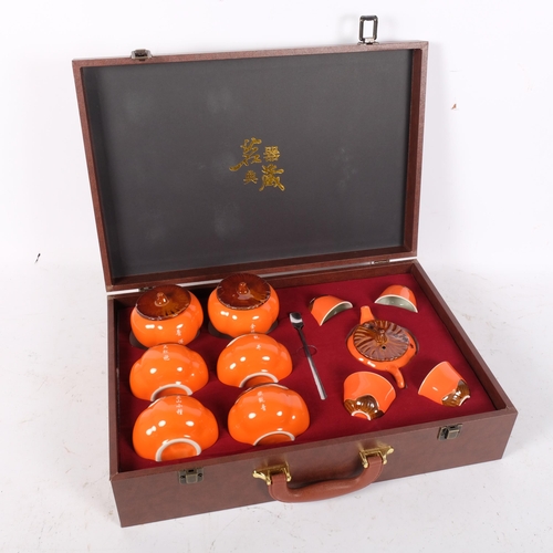 280 - A Chinese Persimmon Kung Fu tea set in fitted case