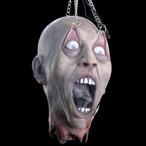 303 - A macabre horror rubber head with hanging chains, height approx 50cm