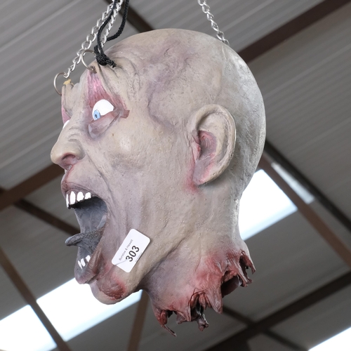 303 - A macabre horror rubber head with hanging chains, height approx 50cm