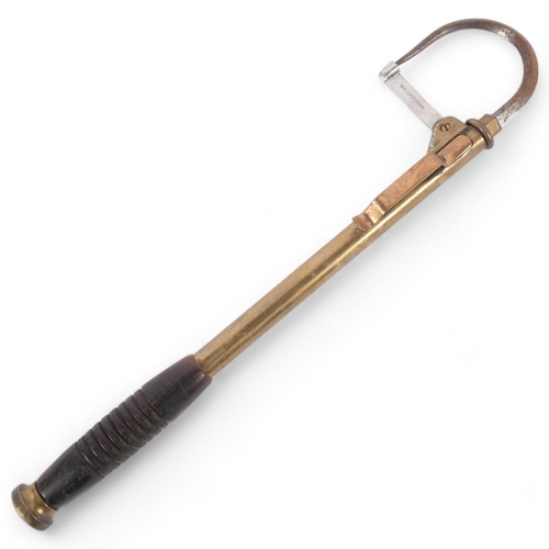 44 - An Antique telescopic fishing gaff, brass-bodied with ebonised turned wood handle, unmarked