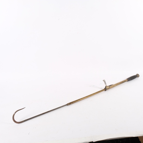 44 - An Antique telescopic fishing gaff, brass-bodied with ebonised turned wood handle, unmarked