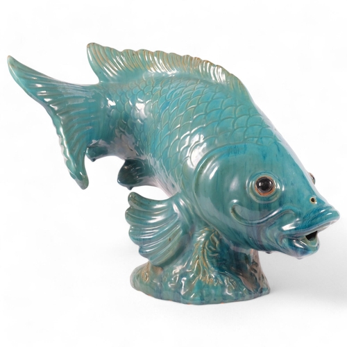 49 - A large ceramic sculpture of a Koi carp, turquoise blue decoration, unmarked, H50cm, L50cm