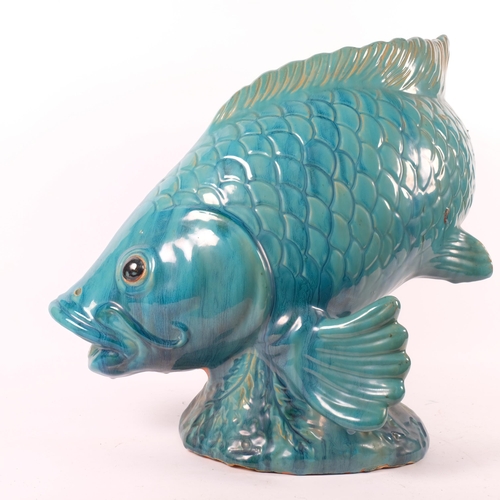 49 - A large ceramic sculpture of a Koi carp, turquoise blue decoration, unmarked, H50cm, L50cm