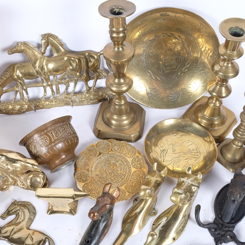 61 - A quantity of brassware, including various candlesticks, vases, etc