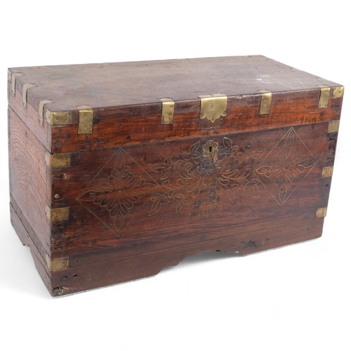 73 - An Anglo-Indian teak travelling box, the rising lid revealing a lift-out fitted interior, mirrored l... 