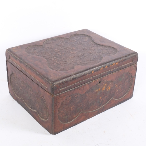 75 - An Antique tooled leather box, having a lift-out sectional tray, floral embossed panel decoration, 3... 