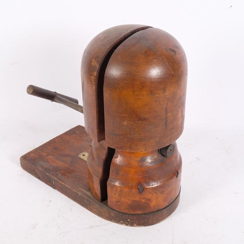 90 - An early 20th century hat stretcher on rectangular stand, with plastic scale, H33cm