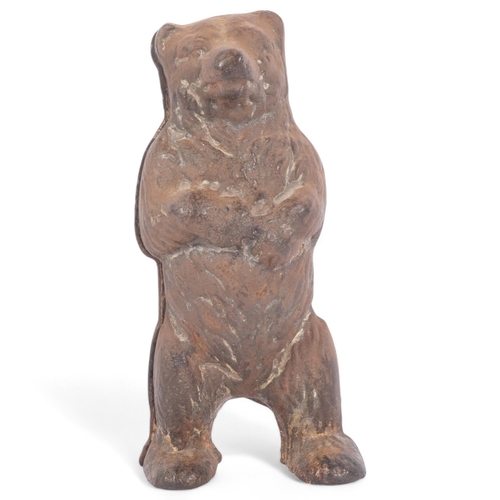 96 - A Vintage cast-iron bear money box, H15cm