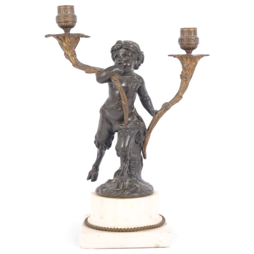 98 - After Clodin, a patinated bronze and gilt-brass 2-branch candelabra, modelled as a faun, mounted on ... 