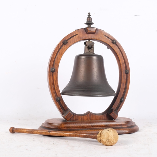 427 - An Antique oak dinner gong, in the form of a horseshoe, H30cm