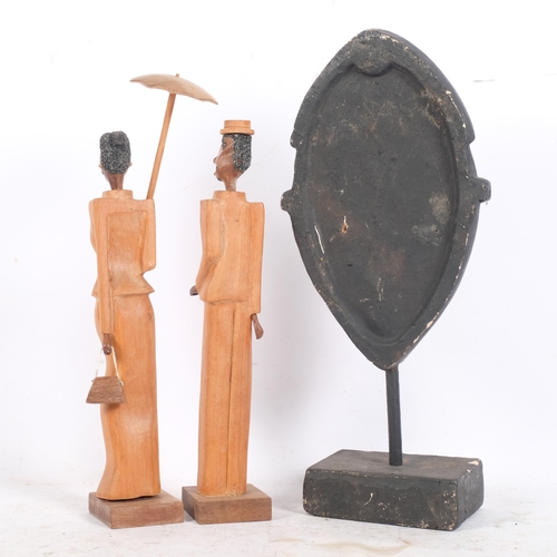 428 - 2 x 1940s Cuban stylised wood figures, and an African plaster mask sculpture on stand, H35cm (3)