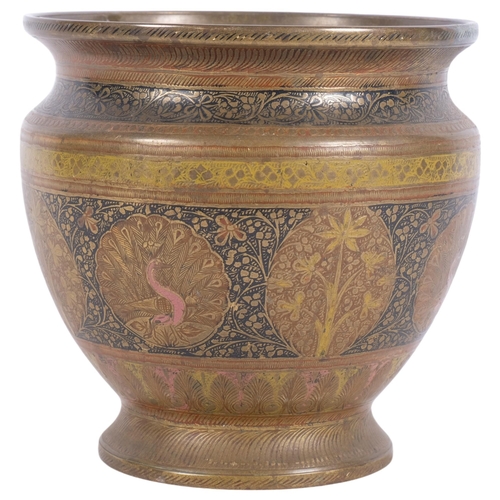 433 - An ornate Anglo-Indian brass planter, with embossed floral and peacock decorative design, H17.5cm