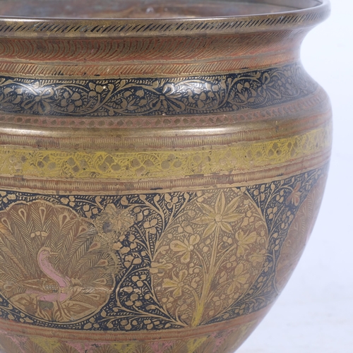 433 - An ornate Anglo-Indian brass planter, with embossed floral and peacock decorative design, H17.5cm