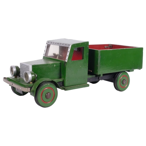 438 - A scratch-built painted pine tipper truck toy, 47cm