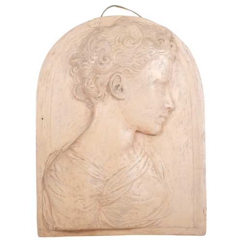 439 - A painted relief plaster figural plaque, depicting the boy St John The Baptist, after works by Donat... 