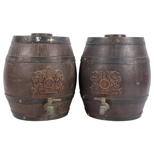 444 - A pair of Gilbey Vintners Sherry barrels, each with brass tap, and wooden logo crest to side, height... 