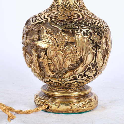 446 - A mid-century style wooden table lamp, with bronze colour finish and relief carved Oriental decorate... 