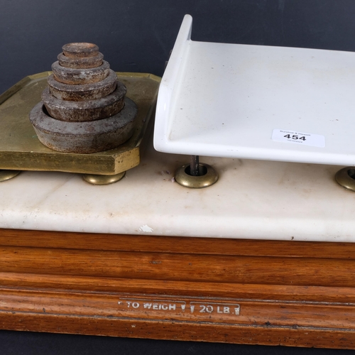 454 - A set of Victorian grocery scales, ceramic and brass weighing plate, with marble top and wooden base... 