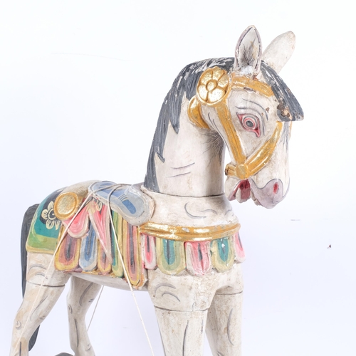 472 - A wooden Folk Art style rocking horse, H60cm, L51.5cm