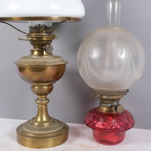 474 - An Antique Victorian brass oil lamp and associated milk glass shade and funnel, H57cm, and a second ... 