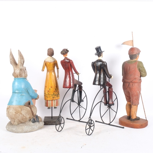 478 - A group of modern composite figures, including a seated rabbit with bowl, lady and gentleman on Penn... 