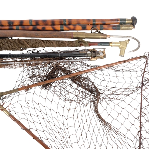 39 - A group of Vintage fishing equipment, including several landing nets, gaffs, etc