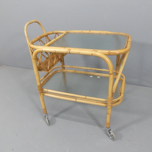 2312 - A mid-century design bamboo two-tier drinks trolley, with inset frosted glass shelves. Length 80cm, ... 