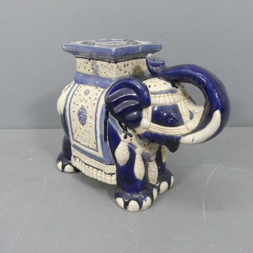 2314 - A painted ceramic elephant design garden seat. Length 55cm, height 42cm, width 23cm.