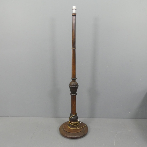 2322 - A 1930s turned mahogany standard lamp. Height to bayonet 150cm.