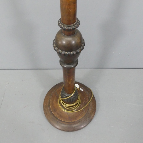 2322 - A 1930s turned mahogany standard lamp. Height to bayonet 150cm.