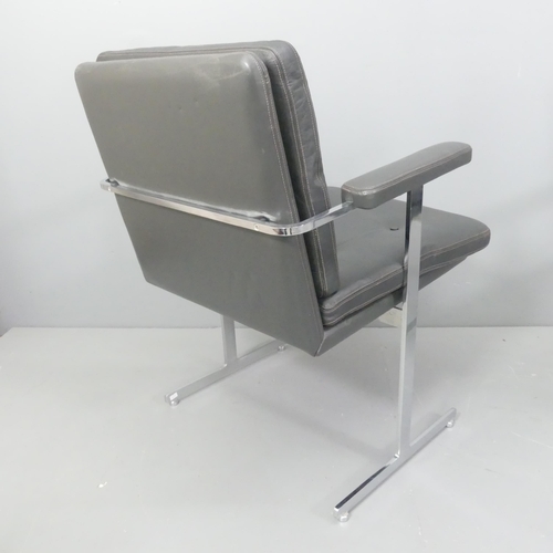 2324 - Robin Day - A mid-century Hille Delphi leather and chrome armchair or desk chair on T shaped legs, w... 